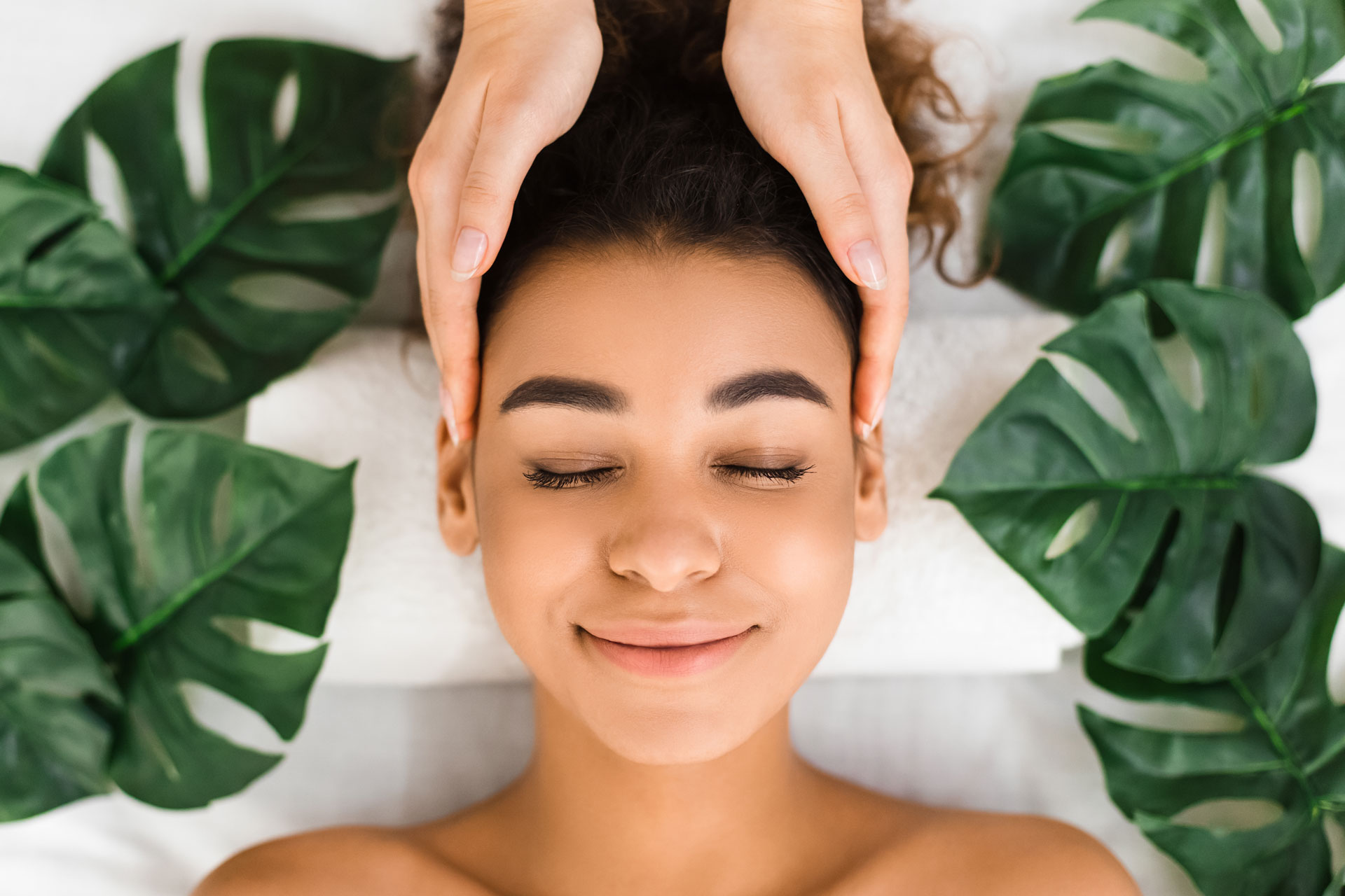 head-massage-afro-girl-getting-spa-treatment-BXBUA4N.jpg